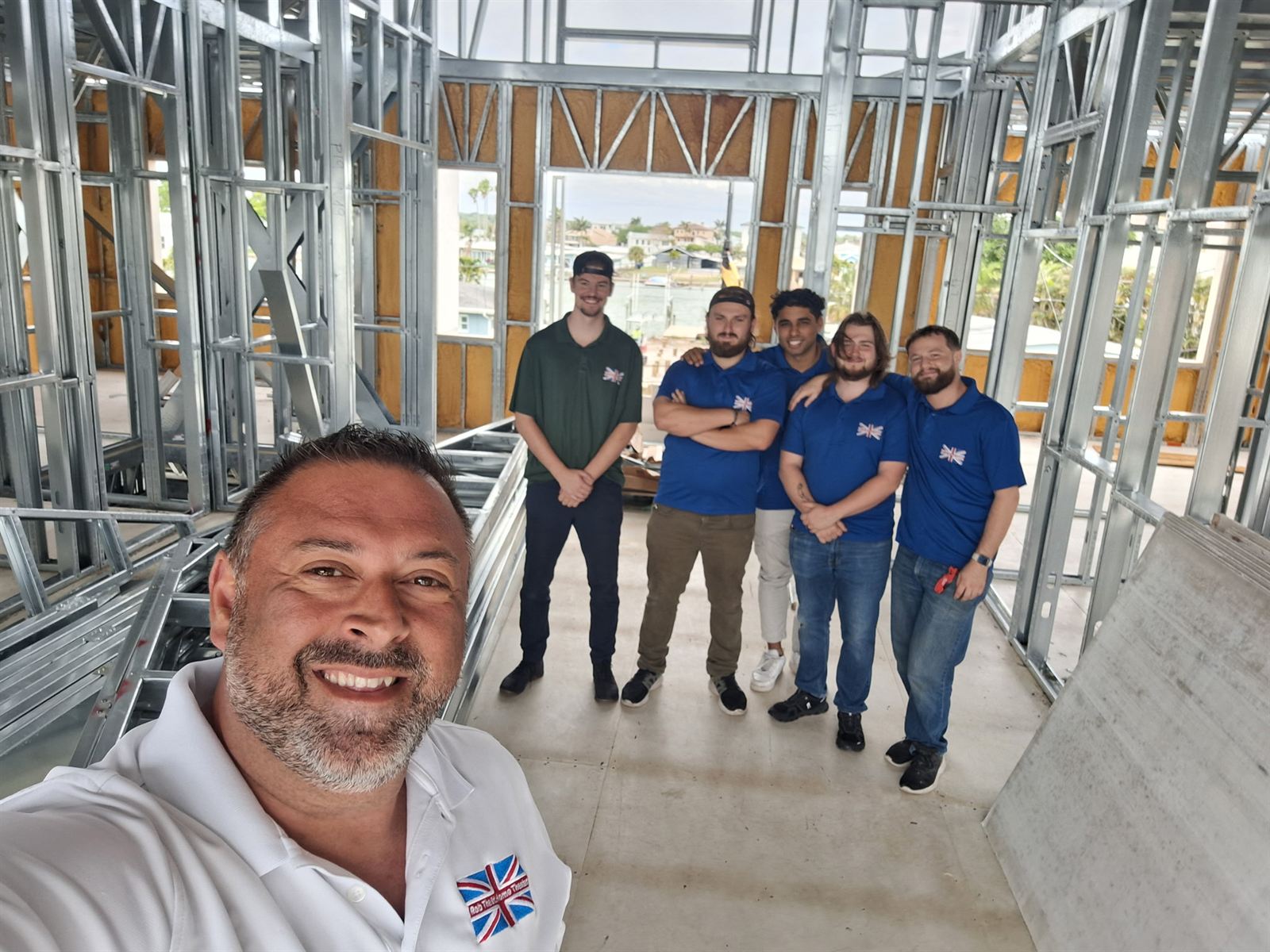 Our crew inside the steel frame of a Florida Steel Homes build