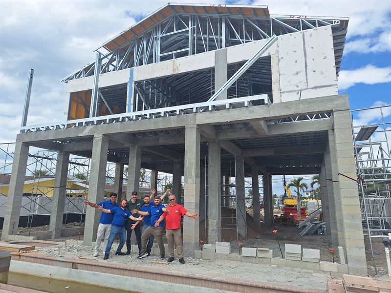 The Rob the Brit crew in front of a Florida Steel Homes build