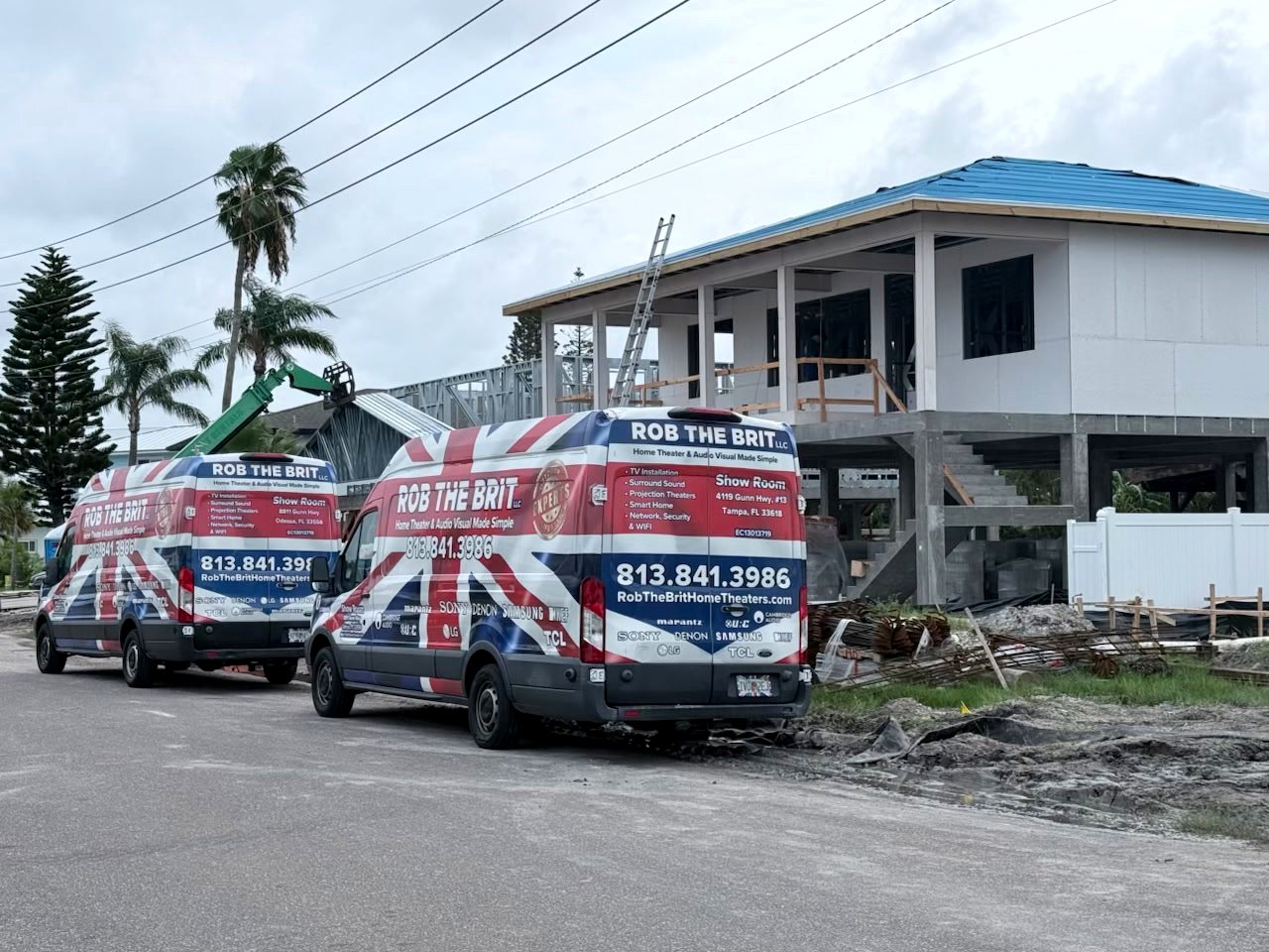 Two Rob the Brit vans at a home under construction