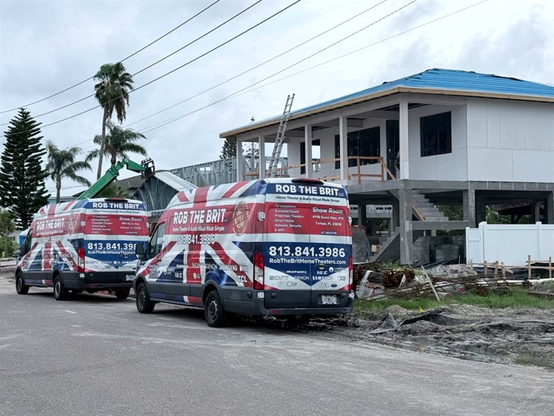 Two Rob the Brit vans at a home under construction
