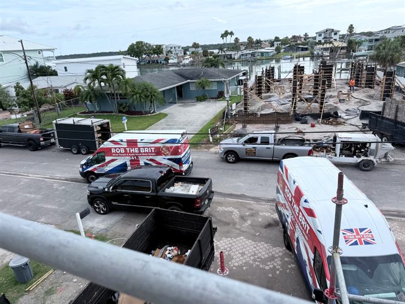 Two Rob the Brit vans on site at a waterfront build