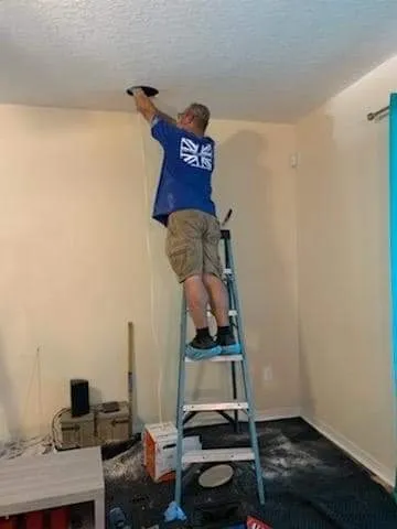 Our installer fitting in-ceiling speakers