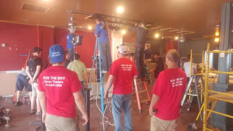 Our crew installing TVs in a restaurant