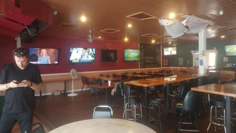 Restaurant dining room with wall TVs