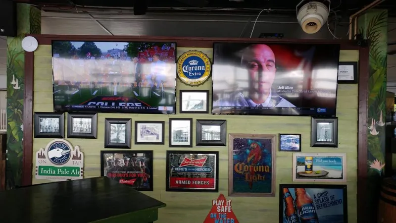 Bar TV wall surrounded by framed photos