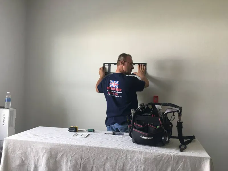 Our installer fitting a projector mount