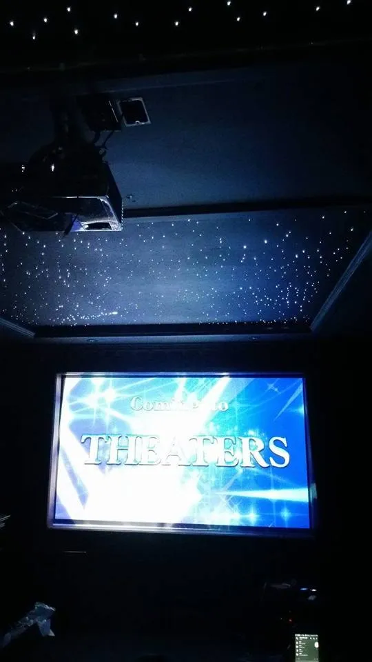 Fiber-optic star ceiling over a projection screen