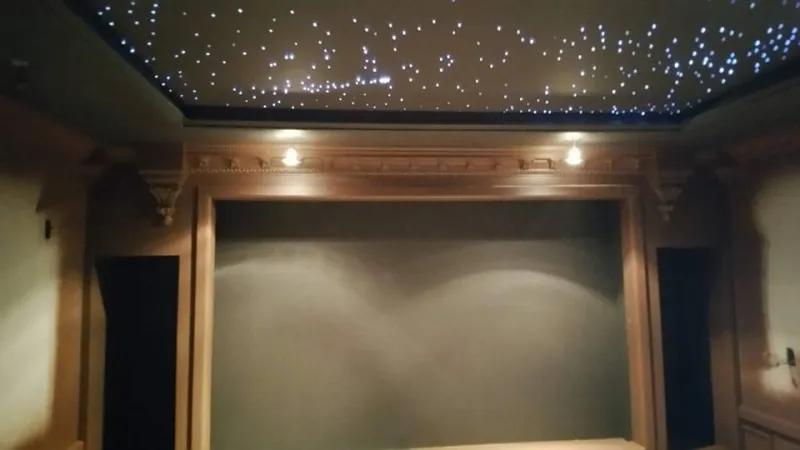 Star-ceiling theater with a projection screen and curtains
