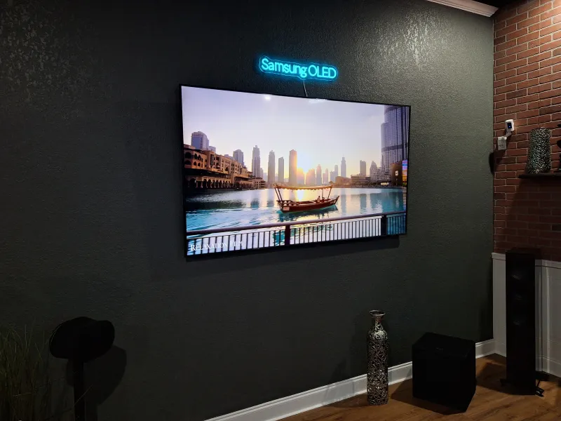 TV on a dark wall in our showroom