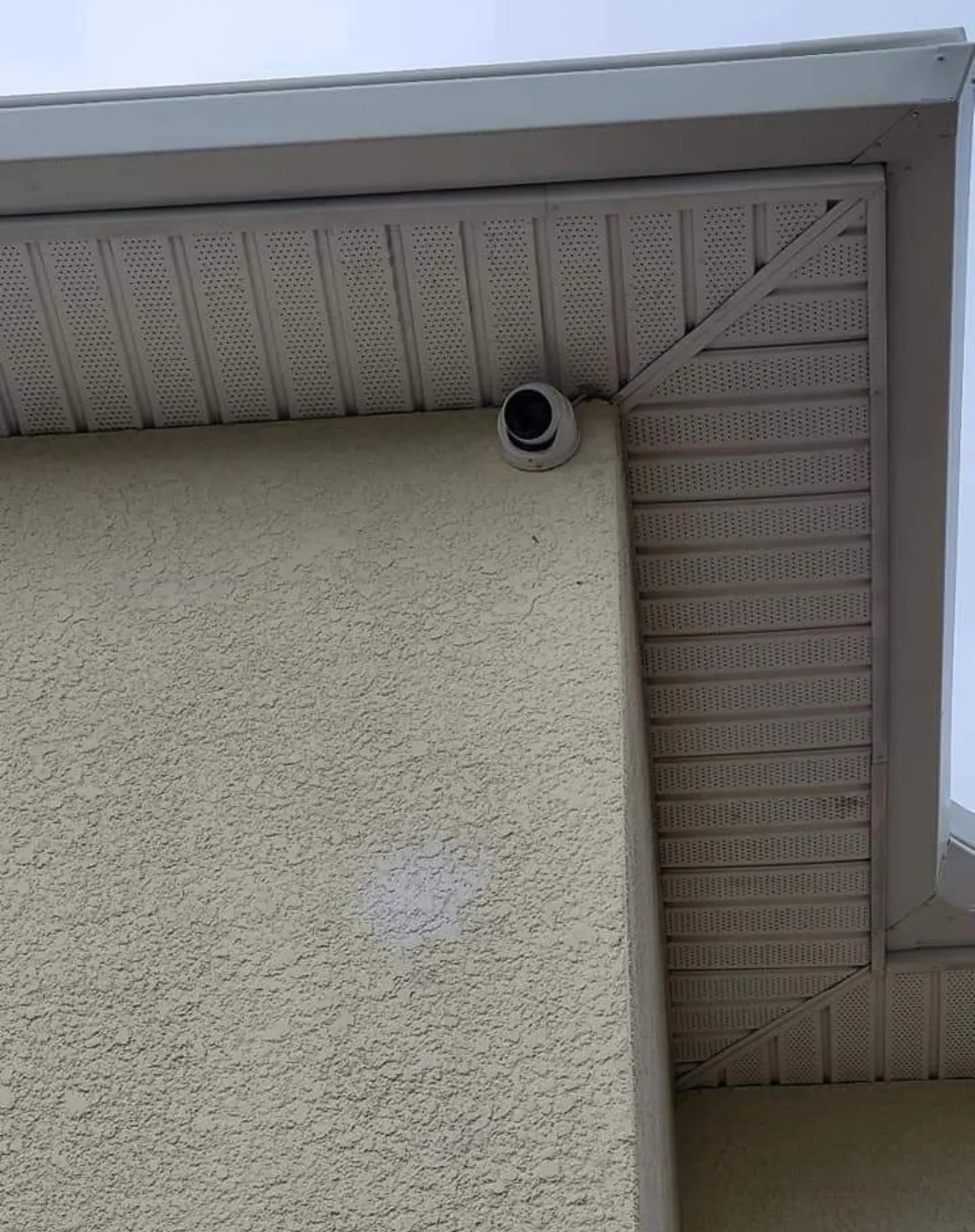 Security camera on an exterior wall